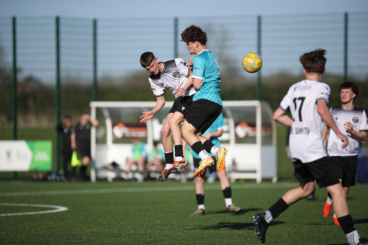 Olly Robinson winning an aerial duel